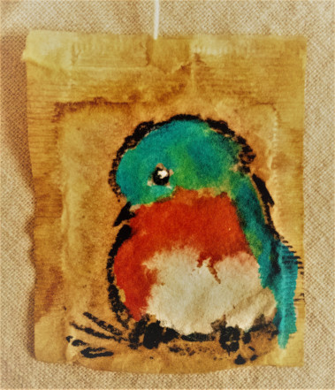 Dawn Gettig, painting on a tea bag, titled Little Bluebird of Happiness